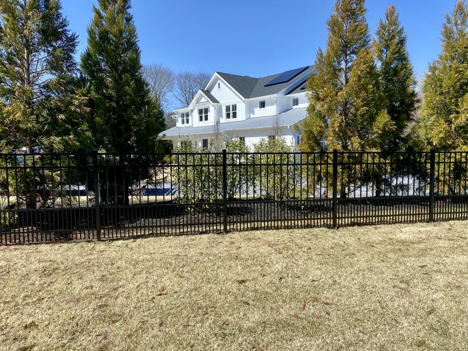 Straight elevation view of a four-foot black aluminum estate fence with puppy pickets in Remsenburg, New York.