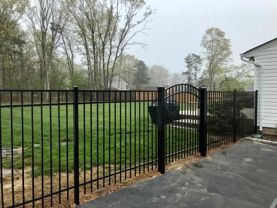 Five-foot black Style 202 aluminum gate and fence run at a Bellport, New York residence.