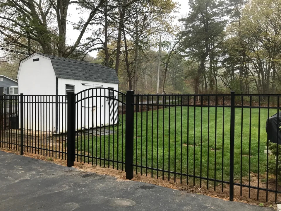 Five-foot black Style 202 aluminum residential fence and gate in Bellport, New York.