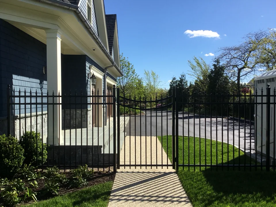 Decorative black aluminum gate at an East Islip waterfront residence