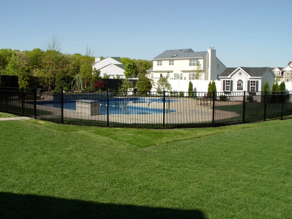 Black aluminum pool and estate fence in Miller Place, New York
