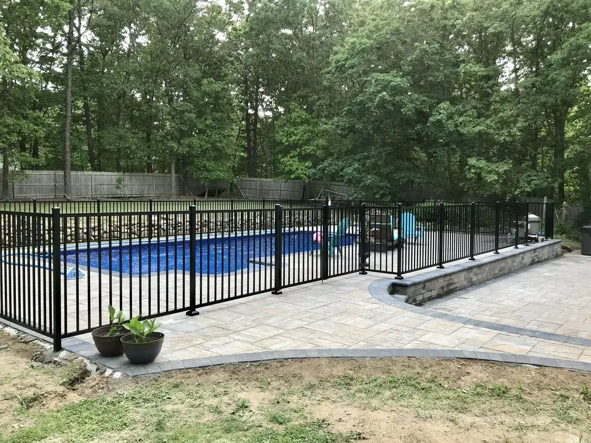 Black aluminum pool fence installation in Westhampton, New York