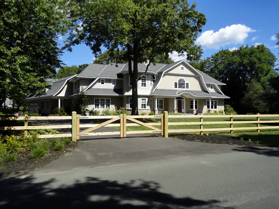 Cedar 3-rail board fence and custom double driveway gate in Bay Shore, NY