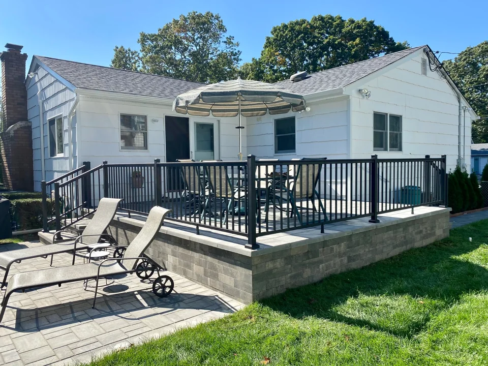 Black aluminum patio railing at a Bellport, New York home