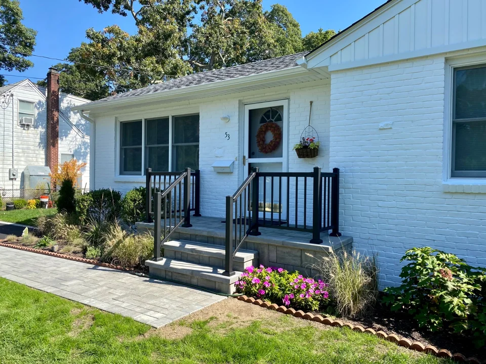 Black aluminum railing at the Bellport, New York home