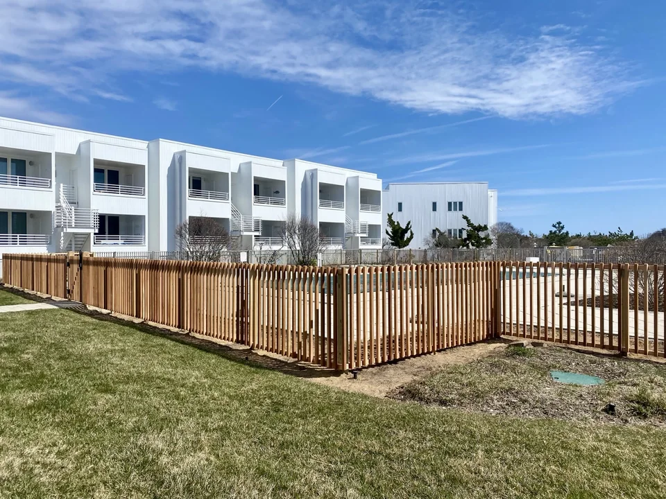Custom cedar swimming pool fence at a condominium in Montauk, New York