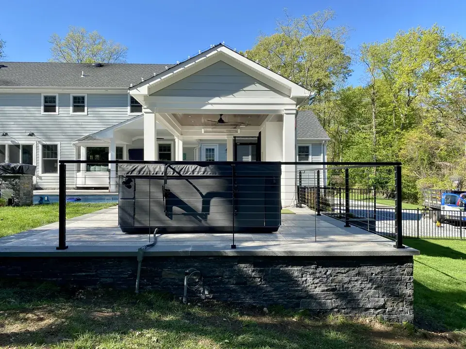 Aluminum cable railing around a raised patio in Suffolk County