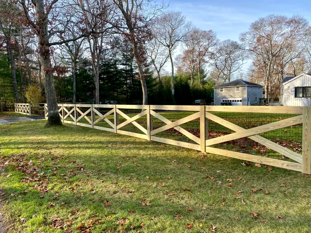 Custom pressure-treated crossbuck fence in Westhampton, New York